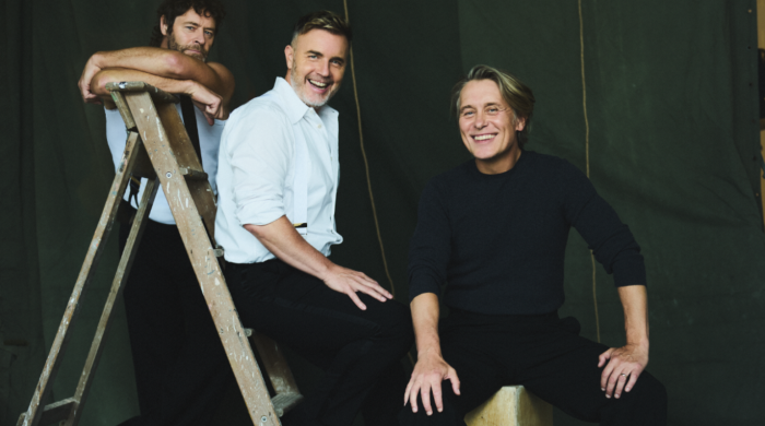 Take That stood on a ladder